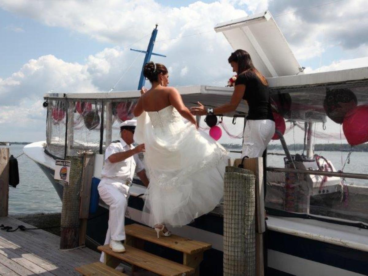 a man standing next to a dock