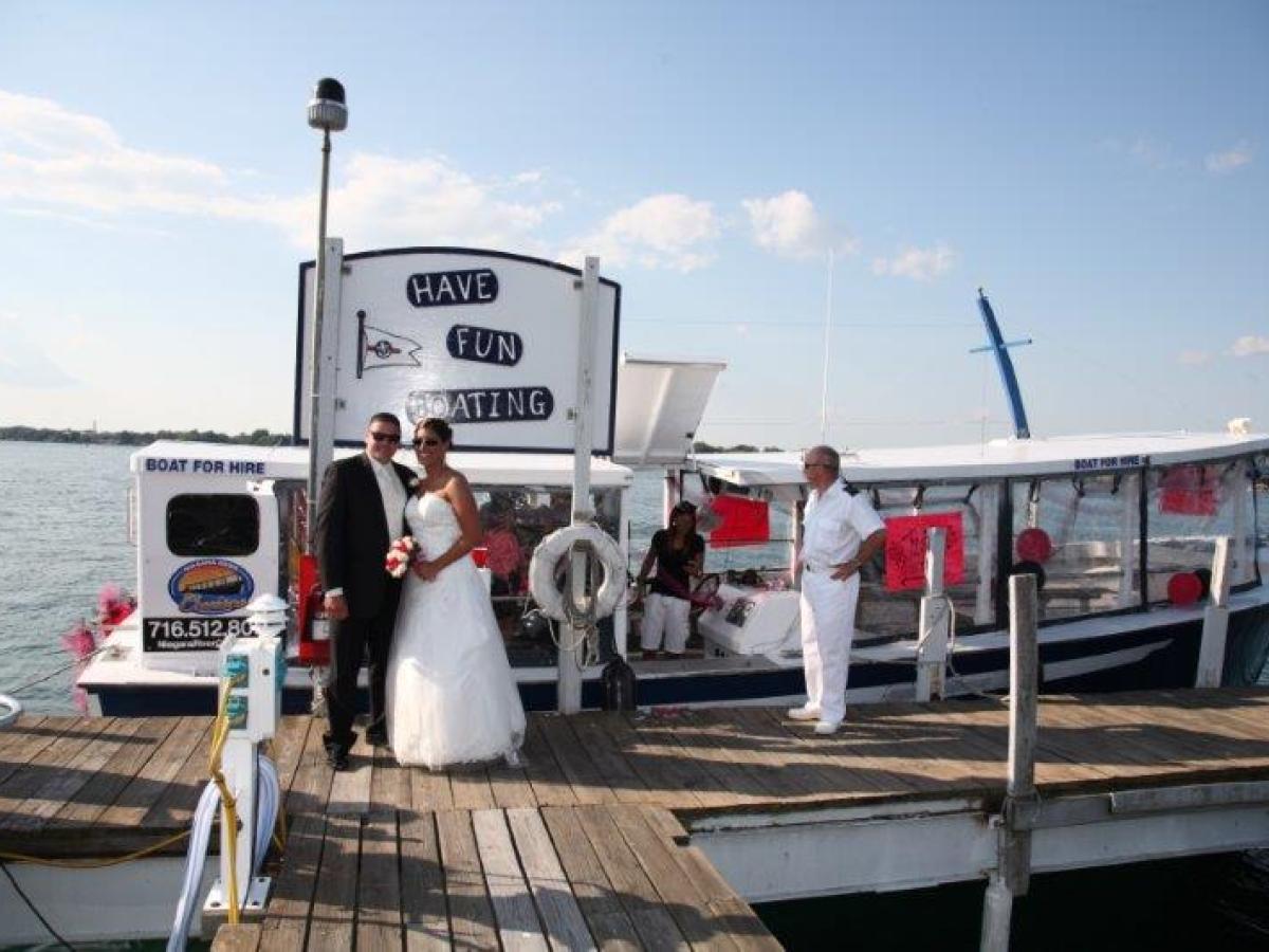 a group of people on a dock near the water