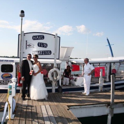 a group of people on a dock near the water