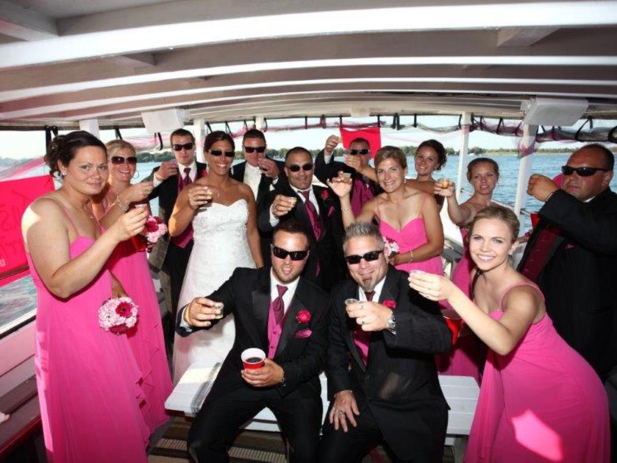 a group of people standing in front of a crowd posing for the camera