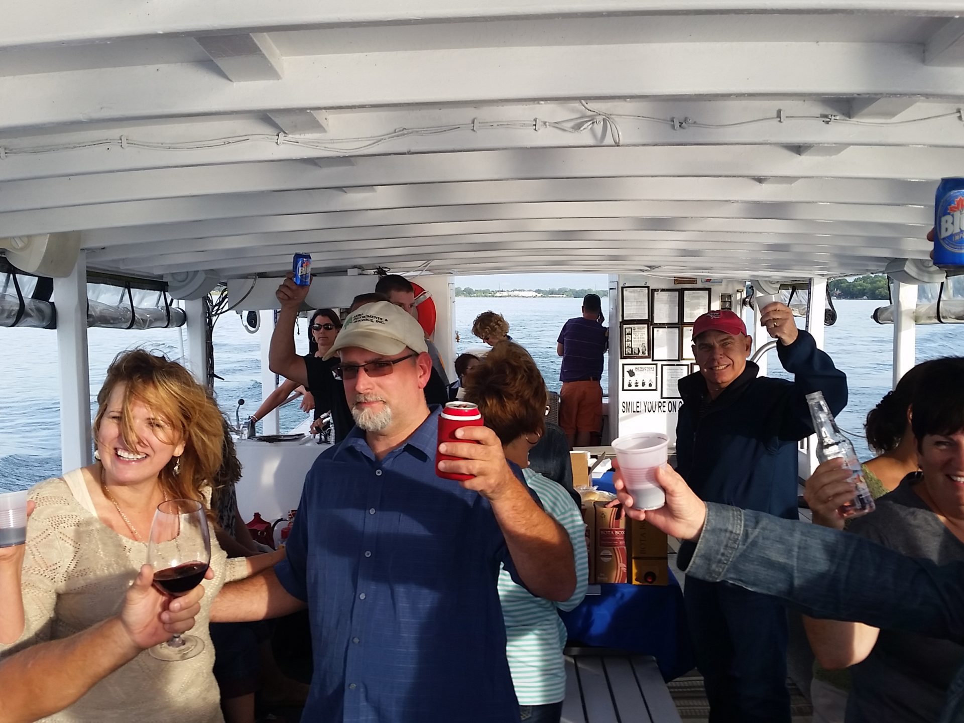 a group of people holding wine glasses