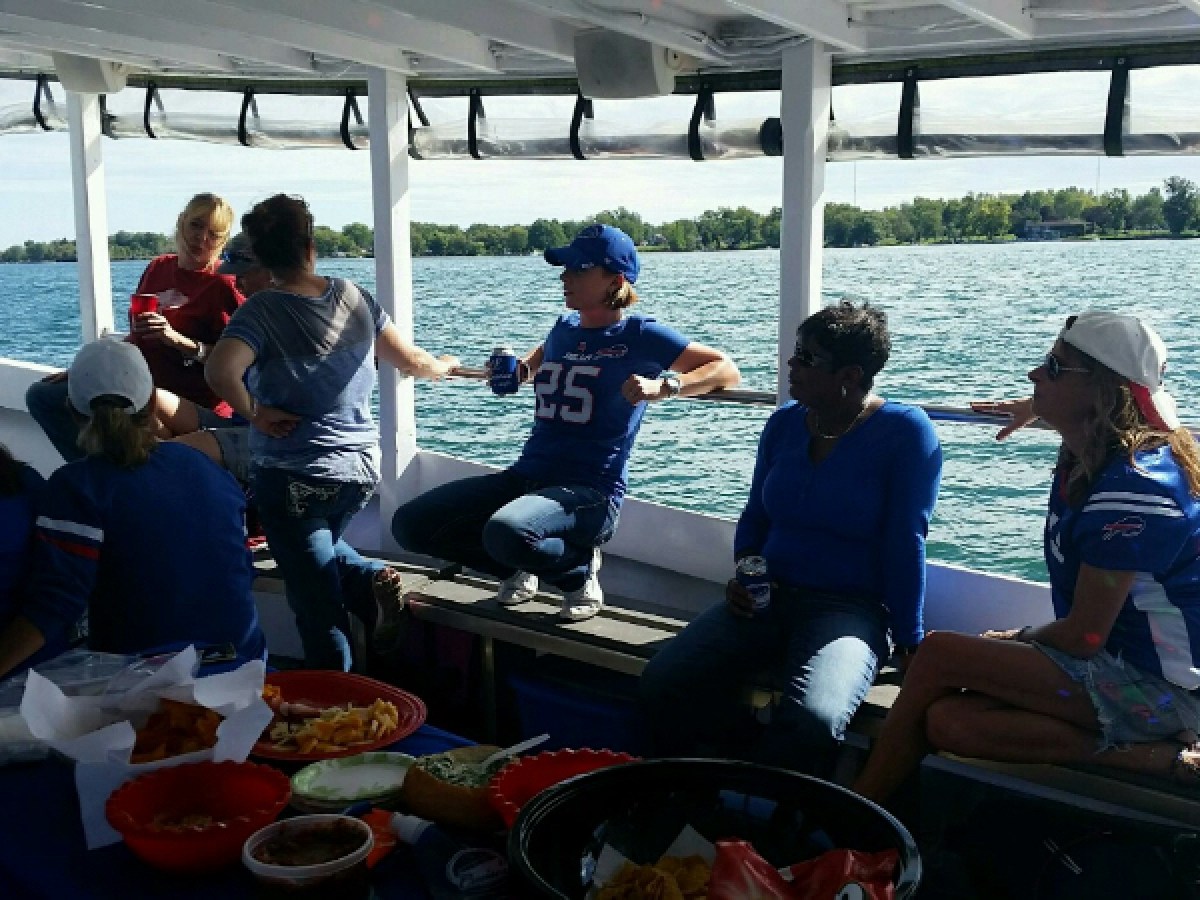 a group of people sitting at a picnic table