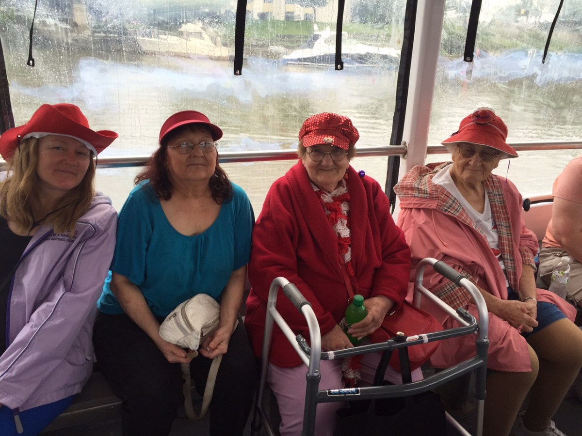 a group of people riding on the back of a boat