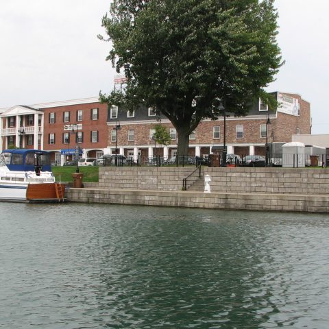 a boat is docked next to a body of water