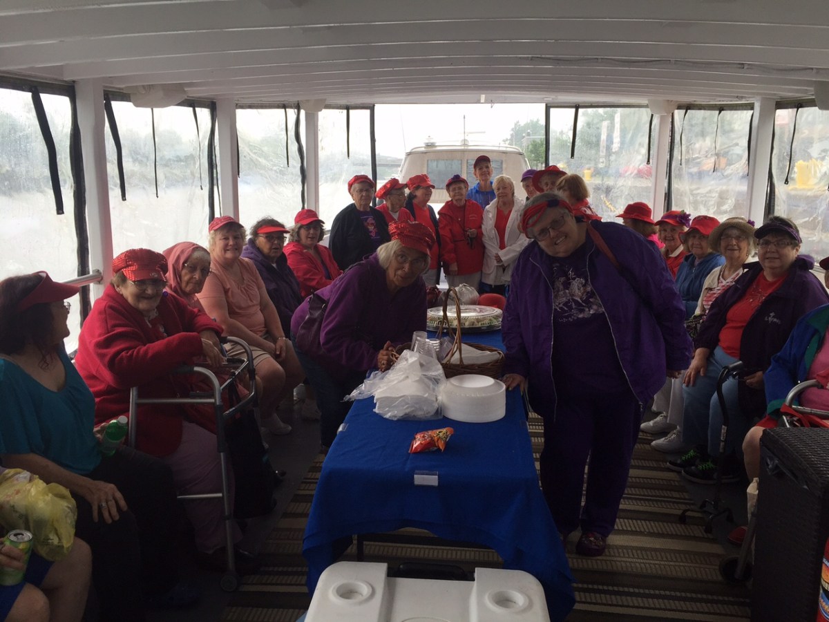 a group of people sitting at a train station