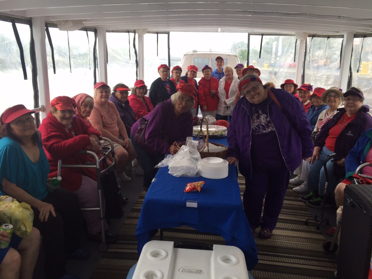 a group of people standing next to a window