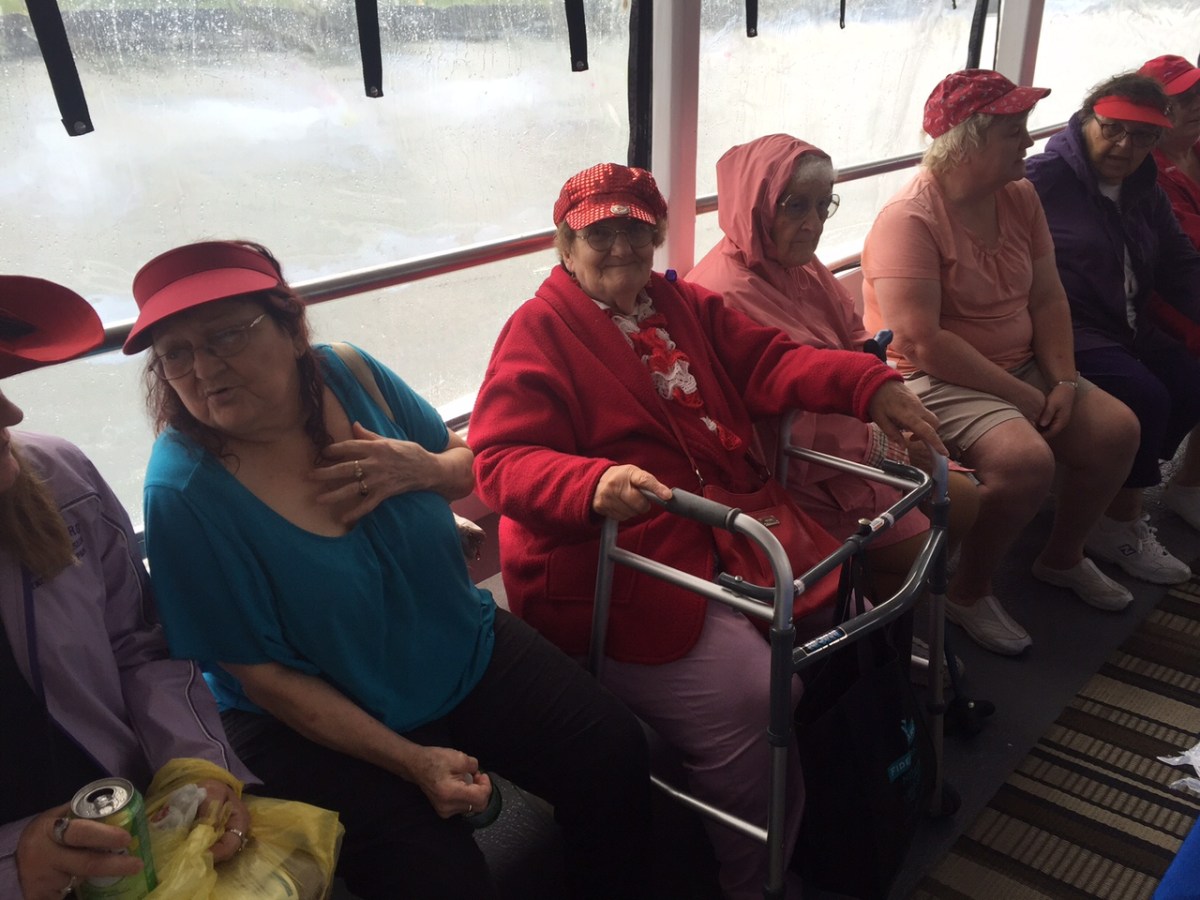 a group of people sitting on a bus