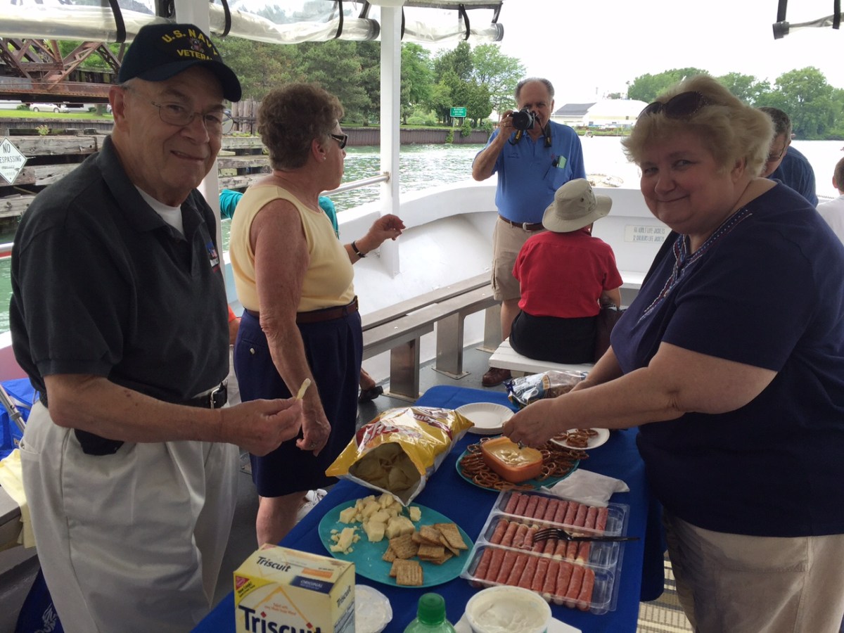 a group of people preparing food in a box