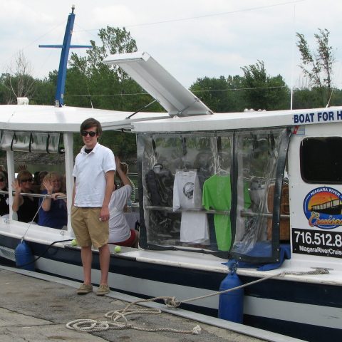 a group of people standing outside of a food truck