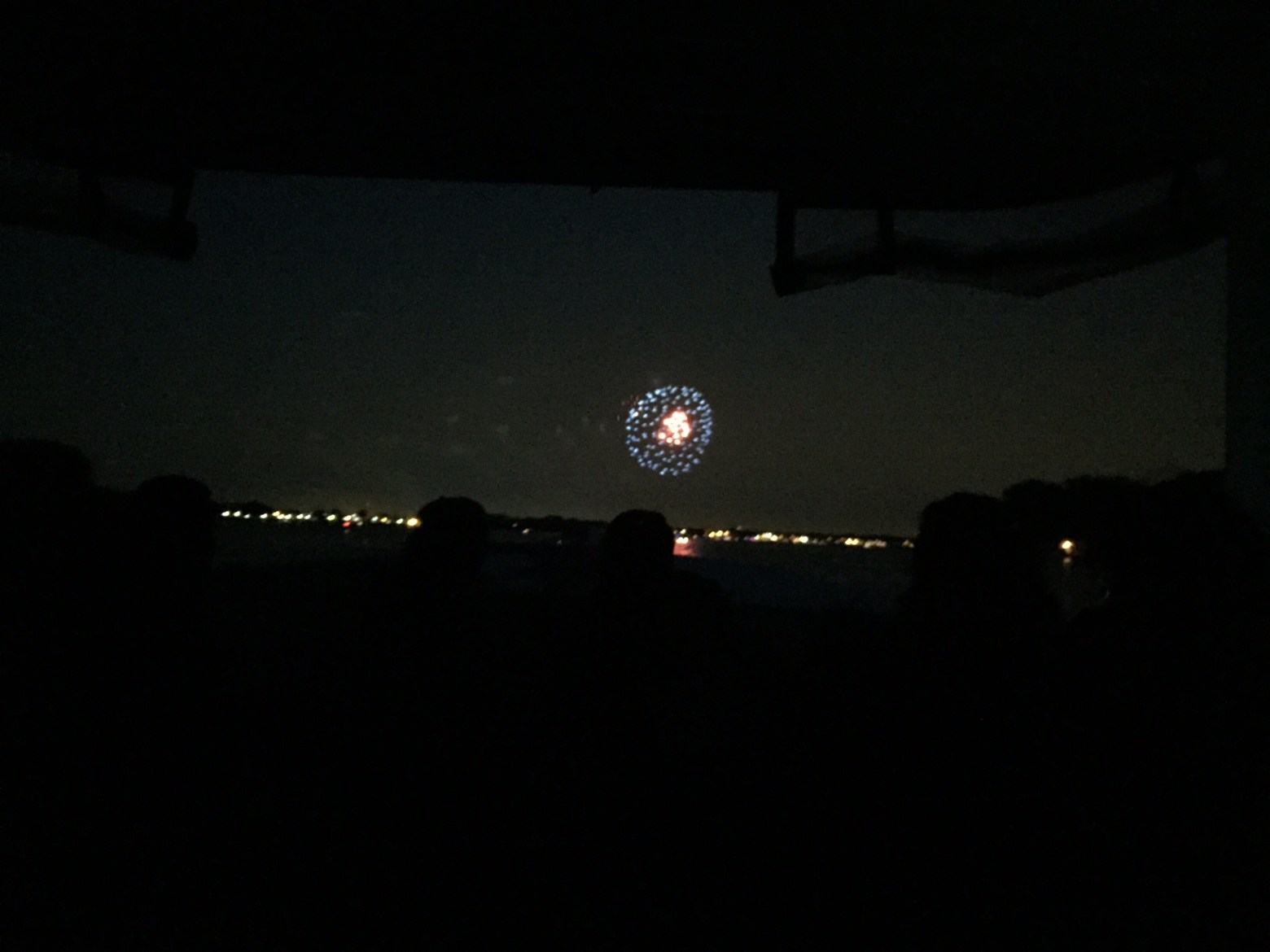 a person sitting in a dark room