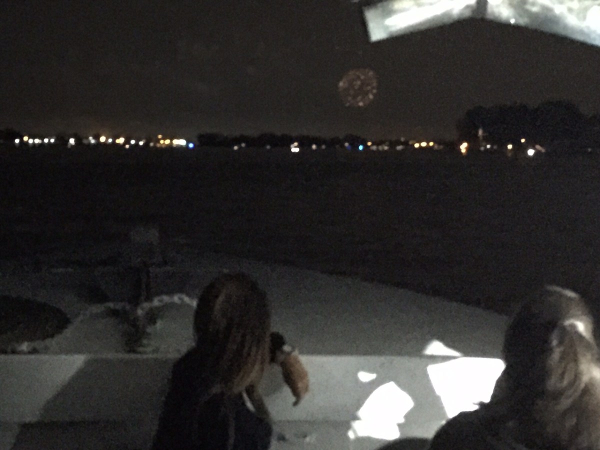 a group of people watching a band on a stage