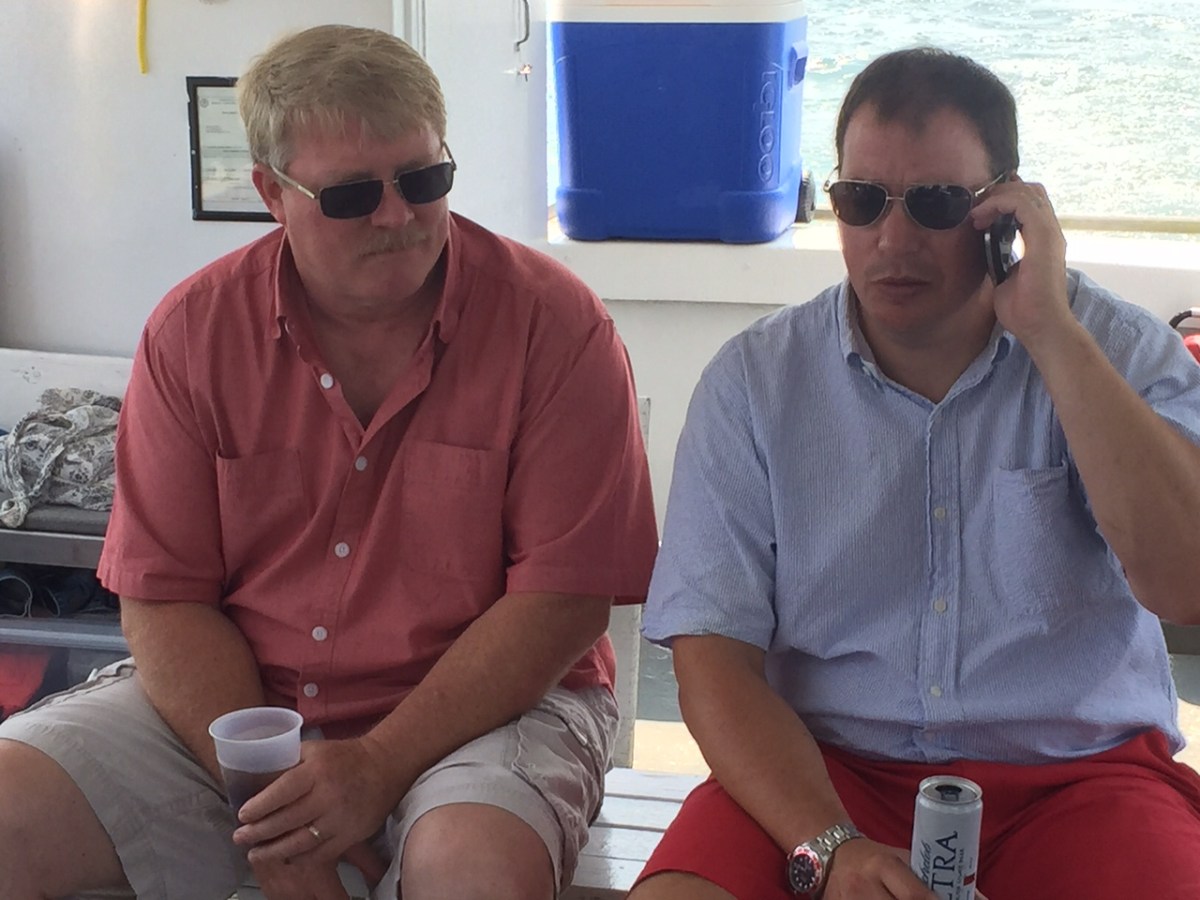 a man and a woman sitting on a table