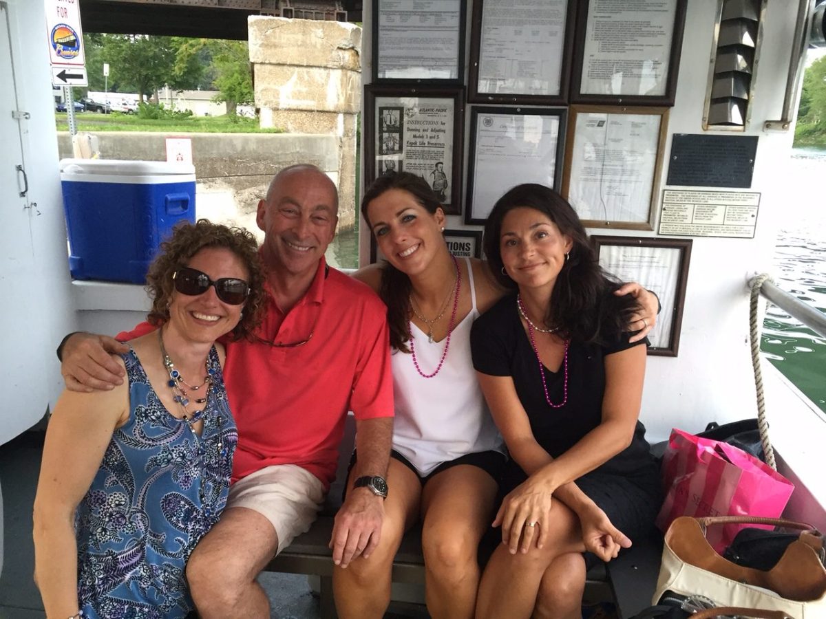 a group of people sitting posing for the camera