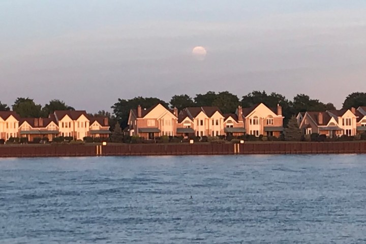 a house next to a body of water