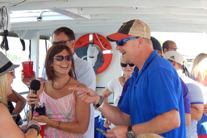 a group of people looking at a phone