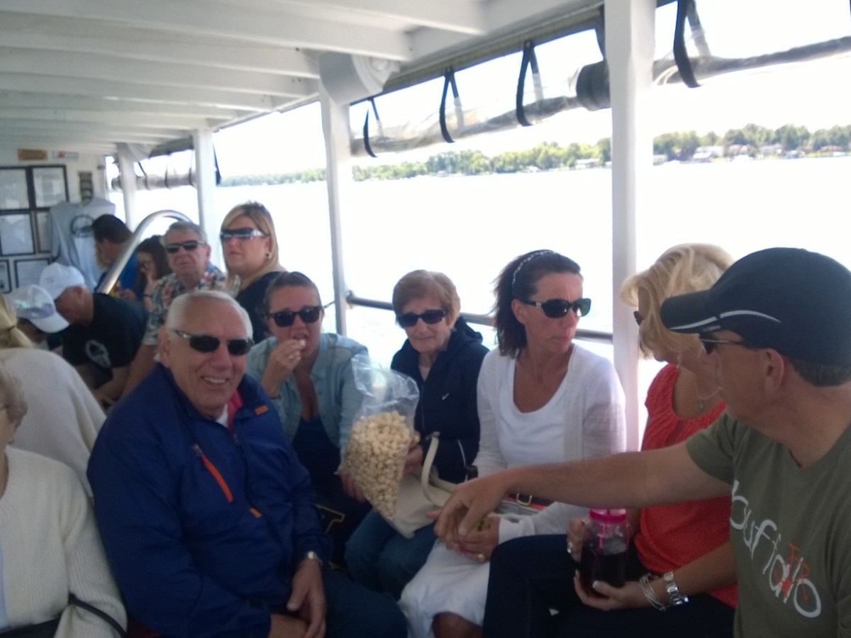 a group of people standing next to a window
