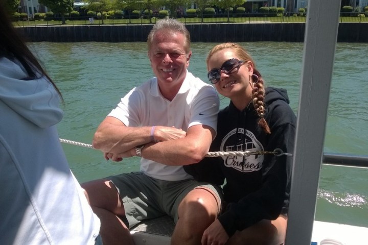 a man sitting in a boat on a body of water