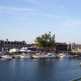 a boat is docked next to a body of water
