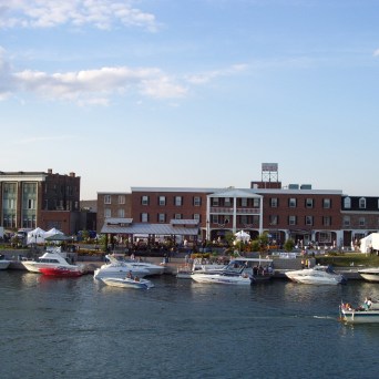 a small boat in a harbor next to a body of water