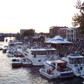 a boat is docked next to a body of water