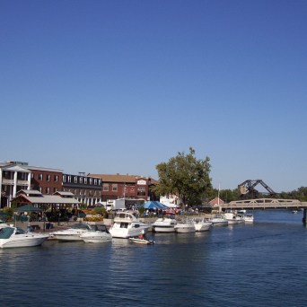 a boat is docked next to a body of water