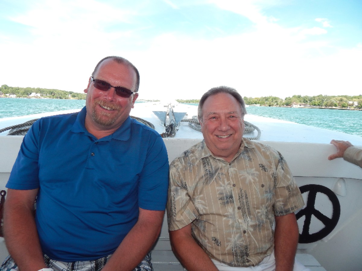a man holding a fish in the water