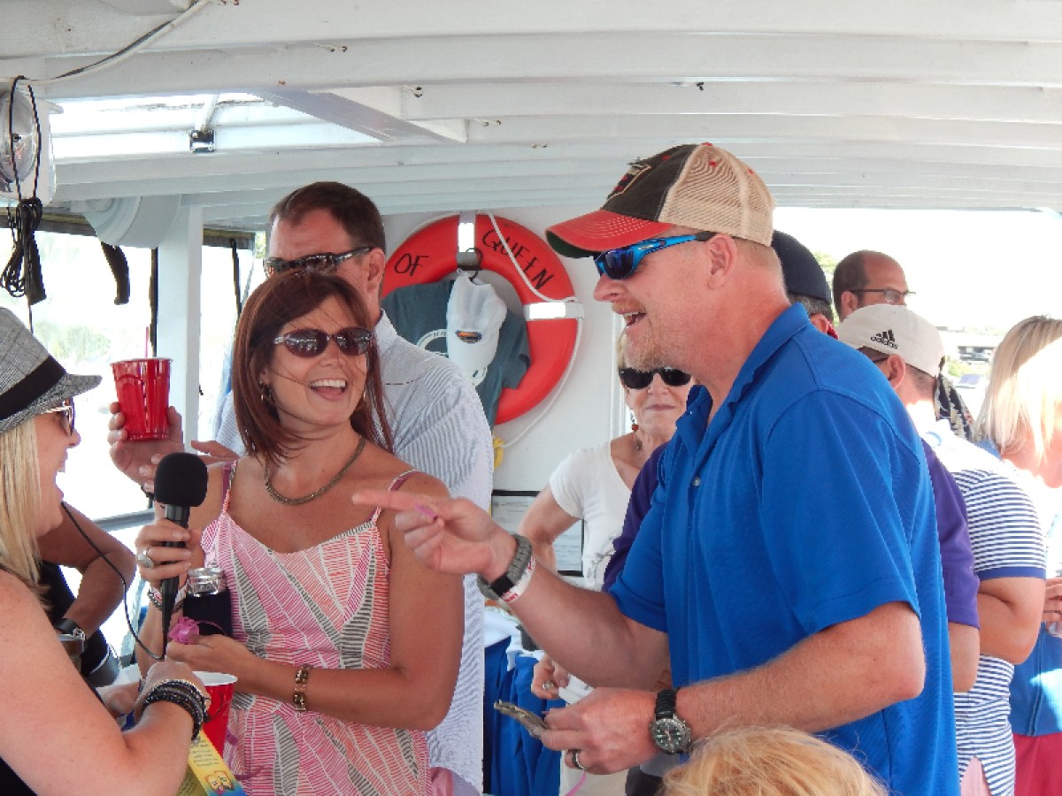 a group of people holding wine glasses
