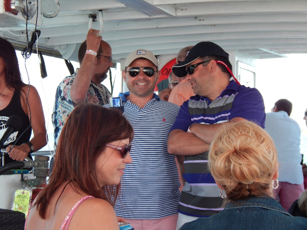 a group of people looking at a cell phone