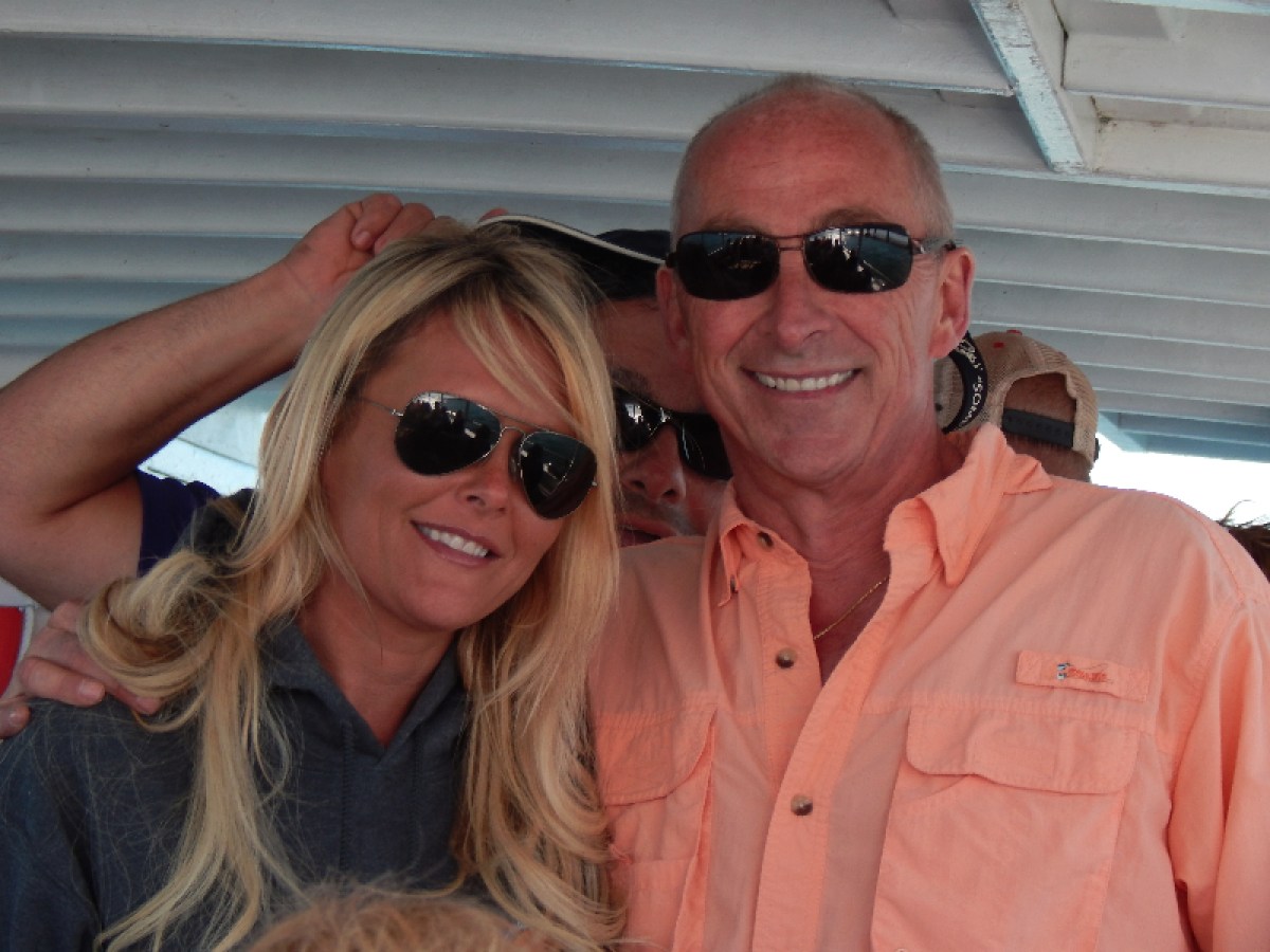 a woman wearing sunglasses posing for the camera