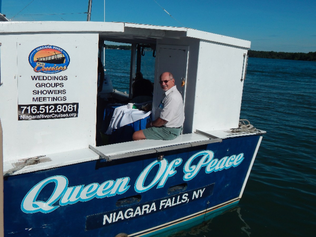 a man standing in front of a sign