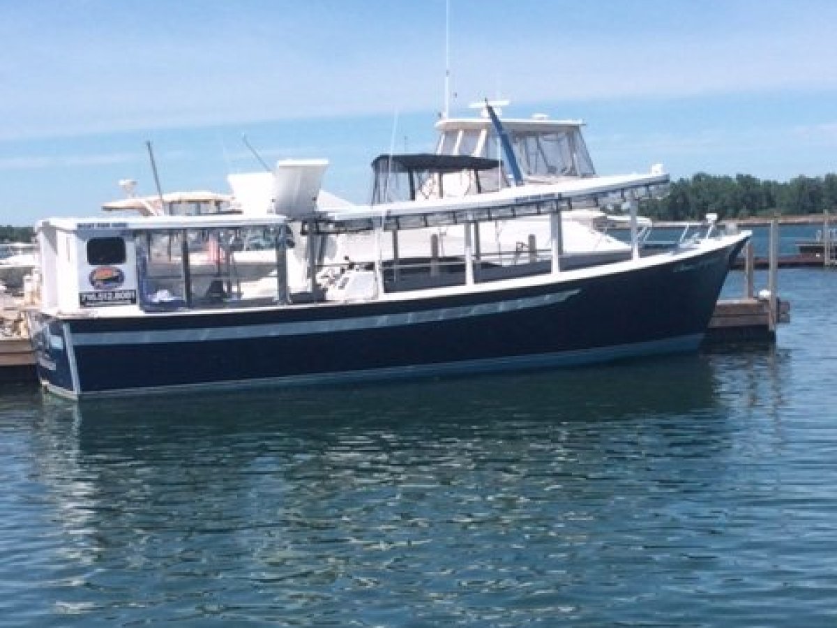 a boat is docked next to a body of water