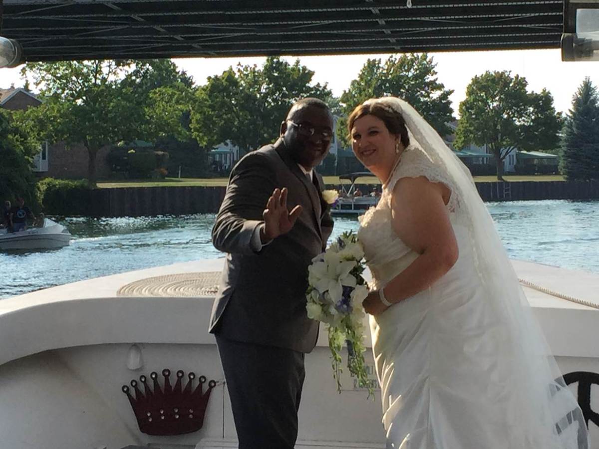 a man and a woman standing in front of water