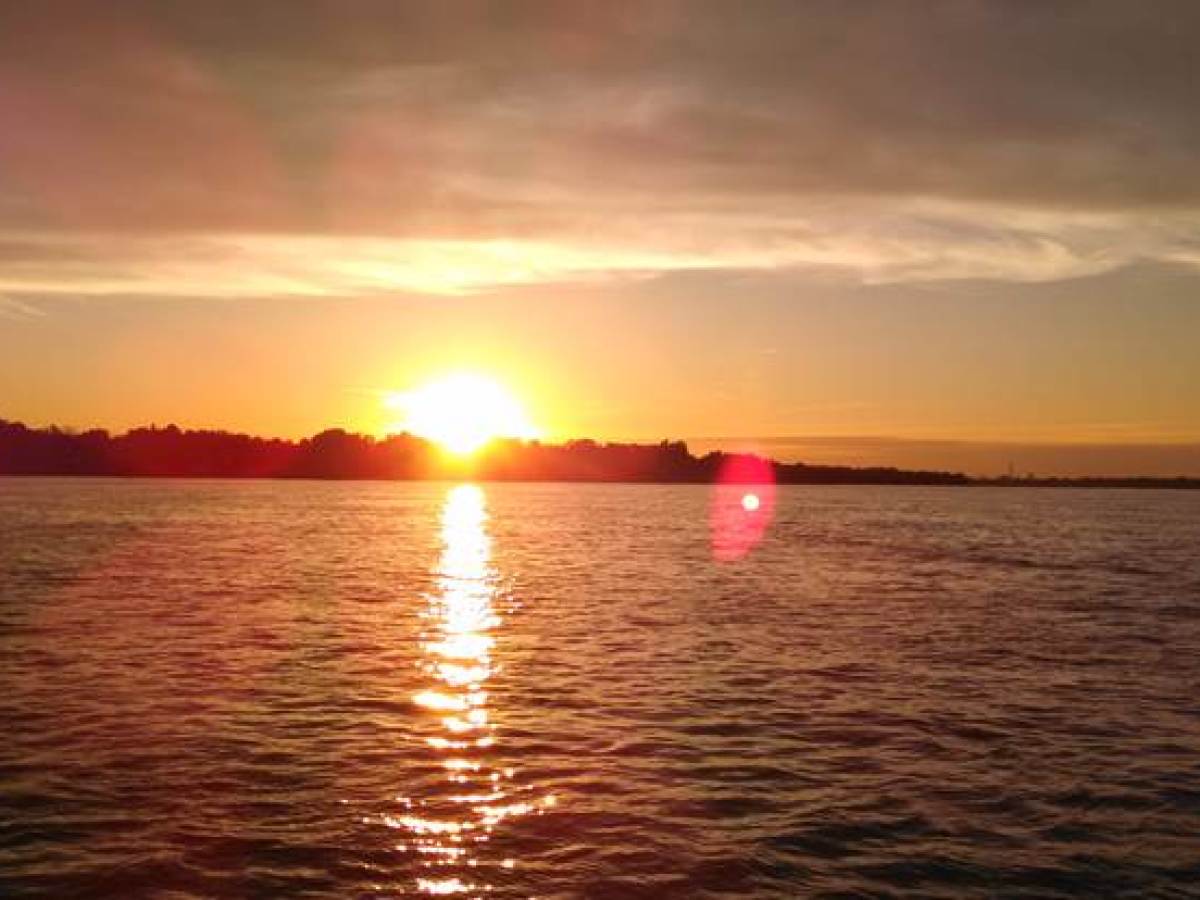 a sunset over a body of water