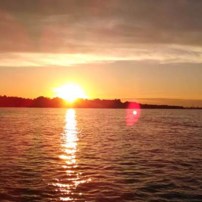 a sunset over a body of water