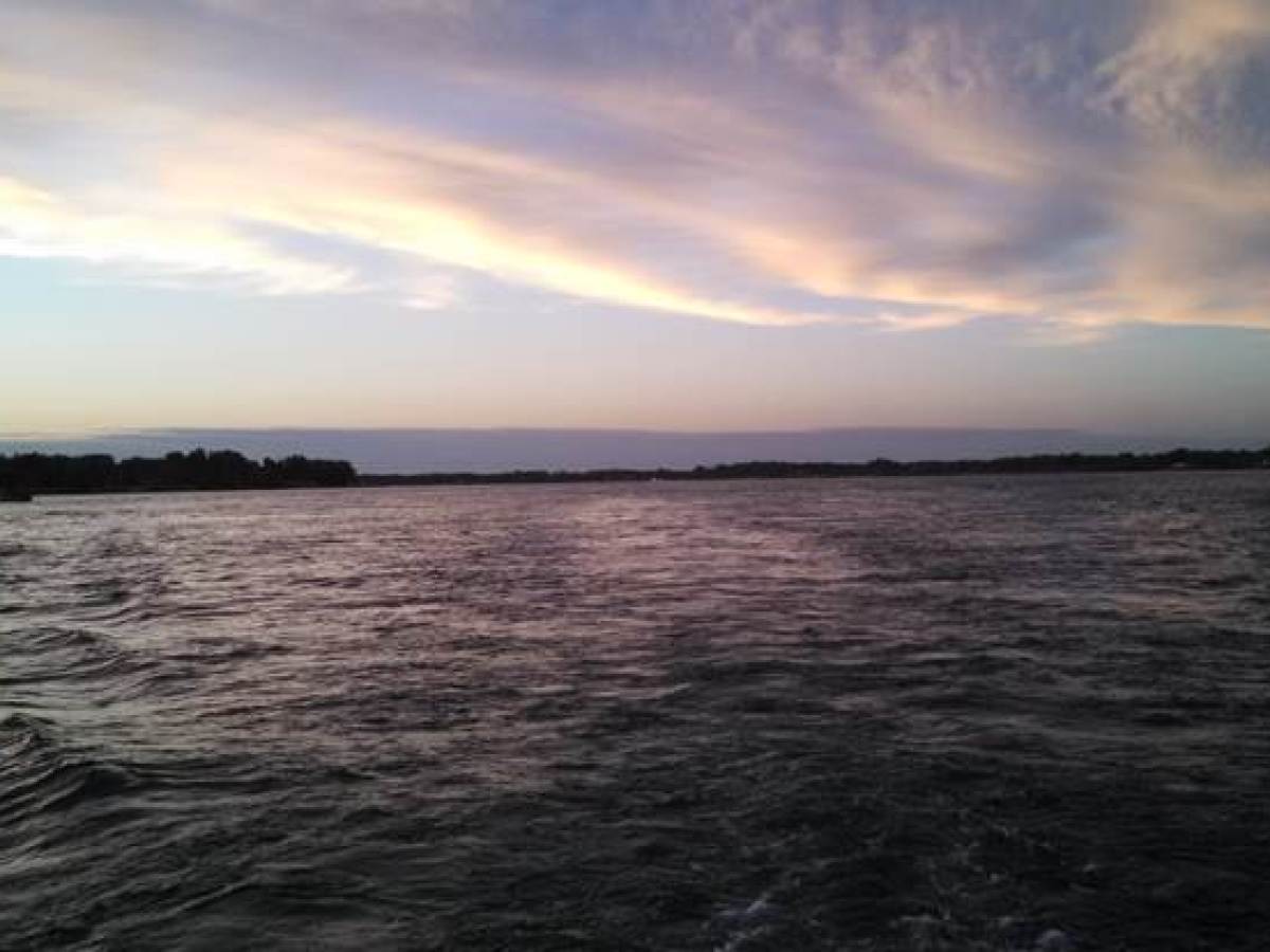 a sunset over a body of water