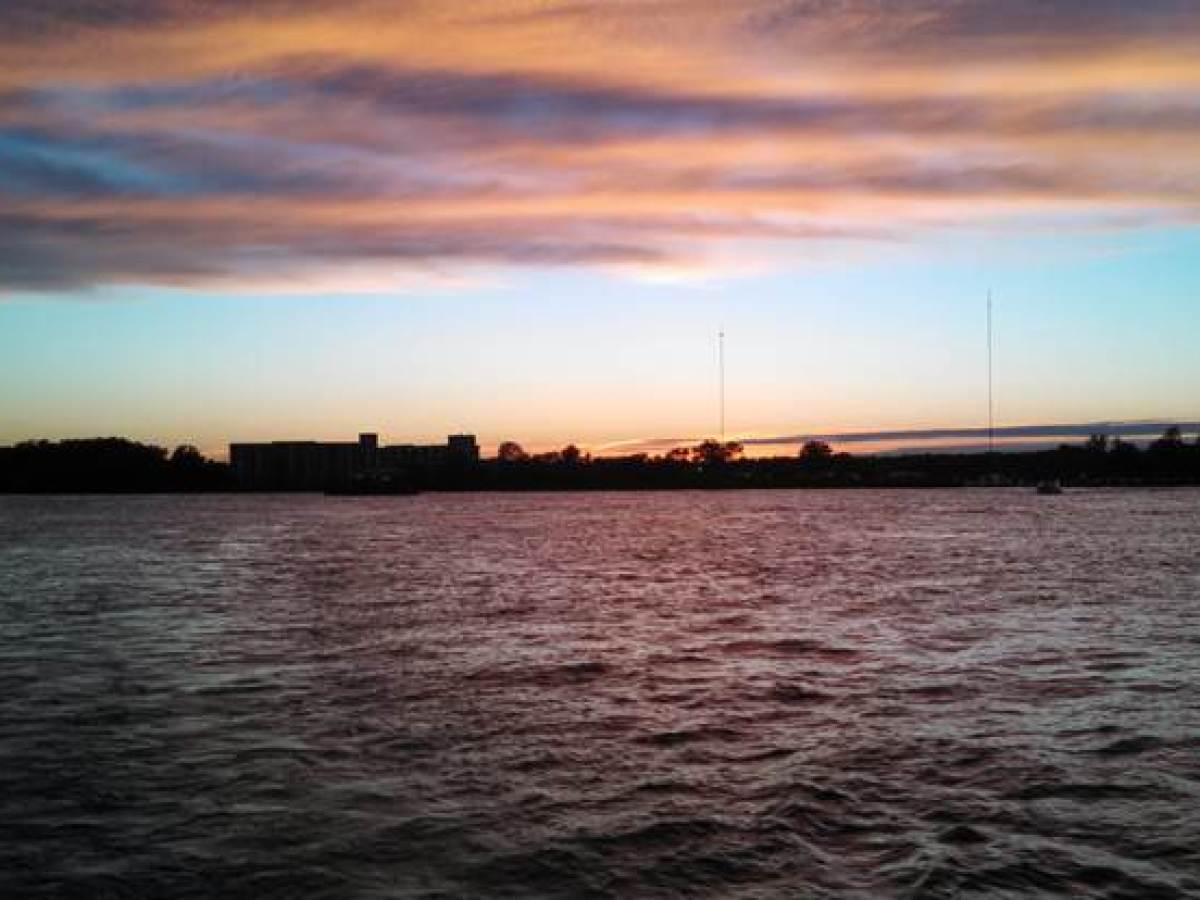 a sunset over a body of water