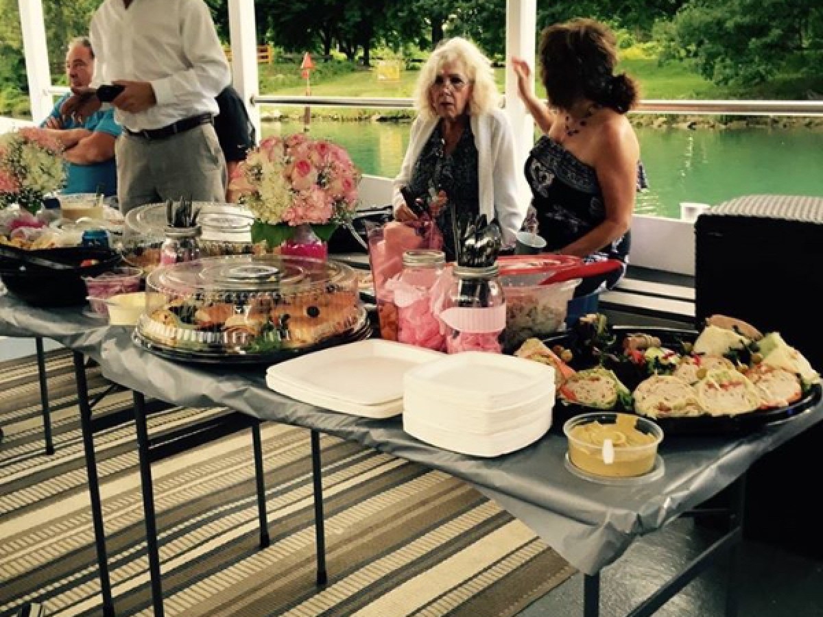 a group of people preparing food on a table