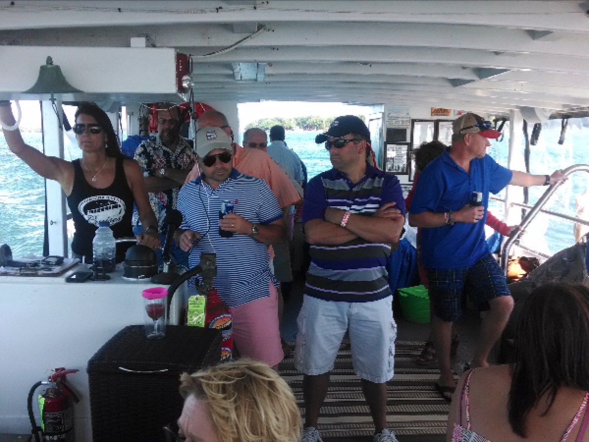 a group of people standing next to a window
