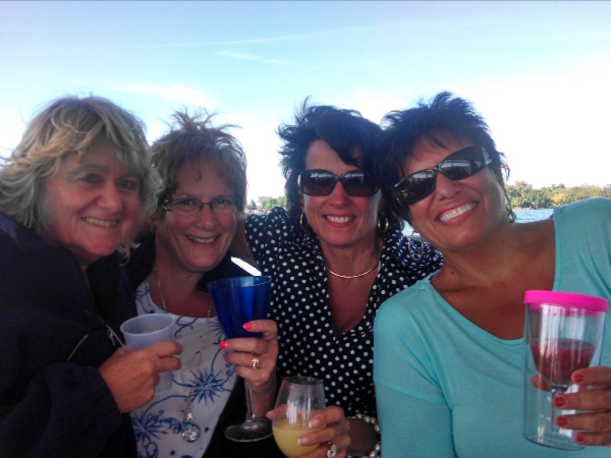 a group of people holding wine glasses