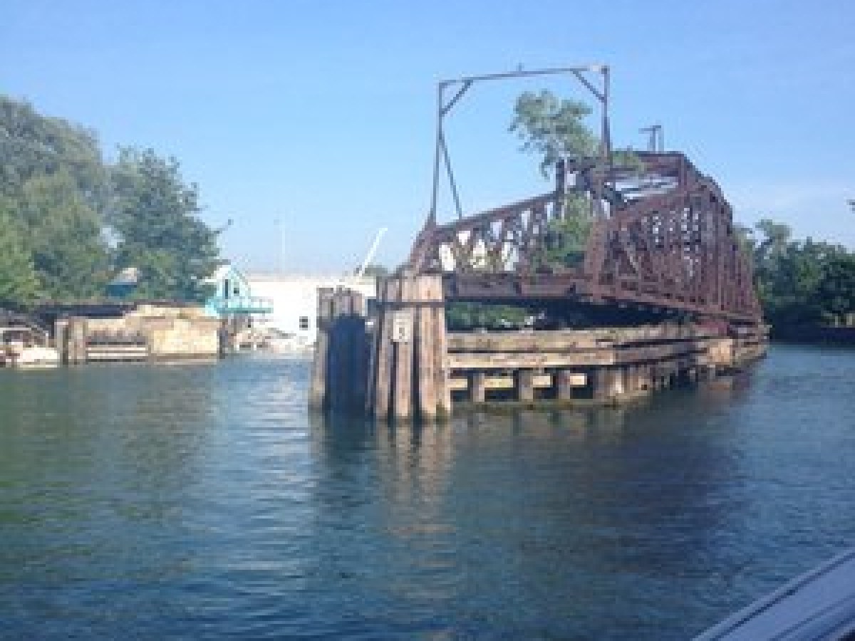 a boat is docked next to a body of water
