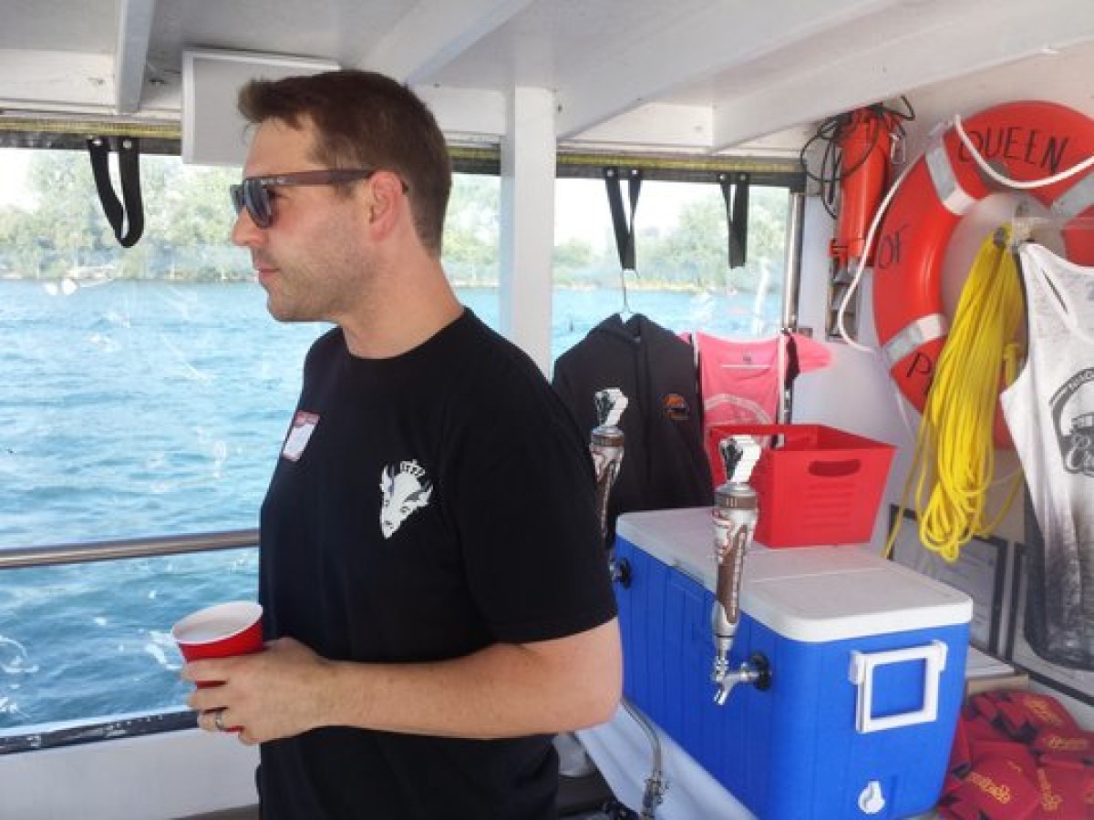 a man standing in front of a boat