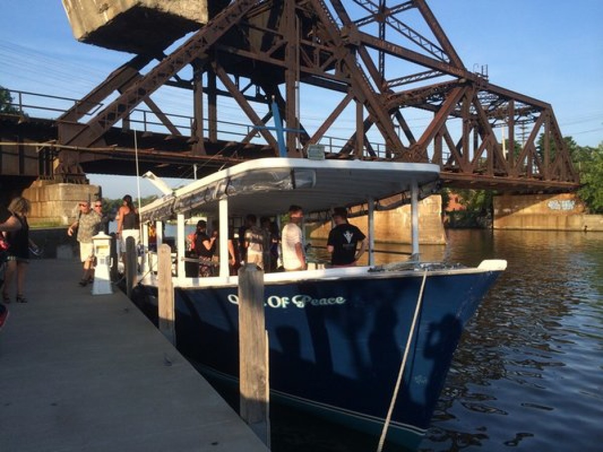 a group of people on a bridge over water