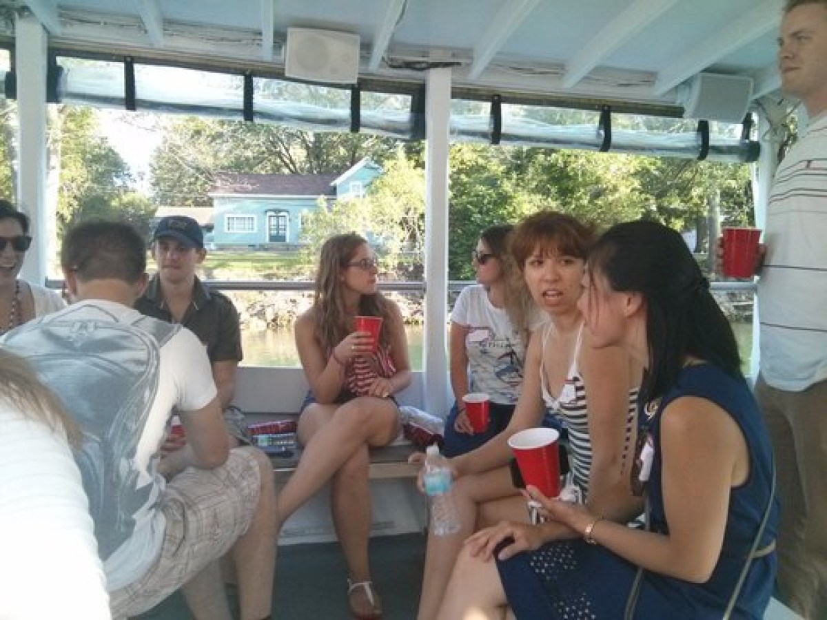 a group of people sitting next to a window