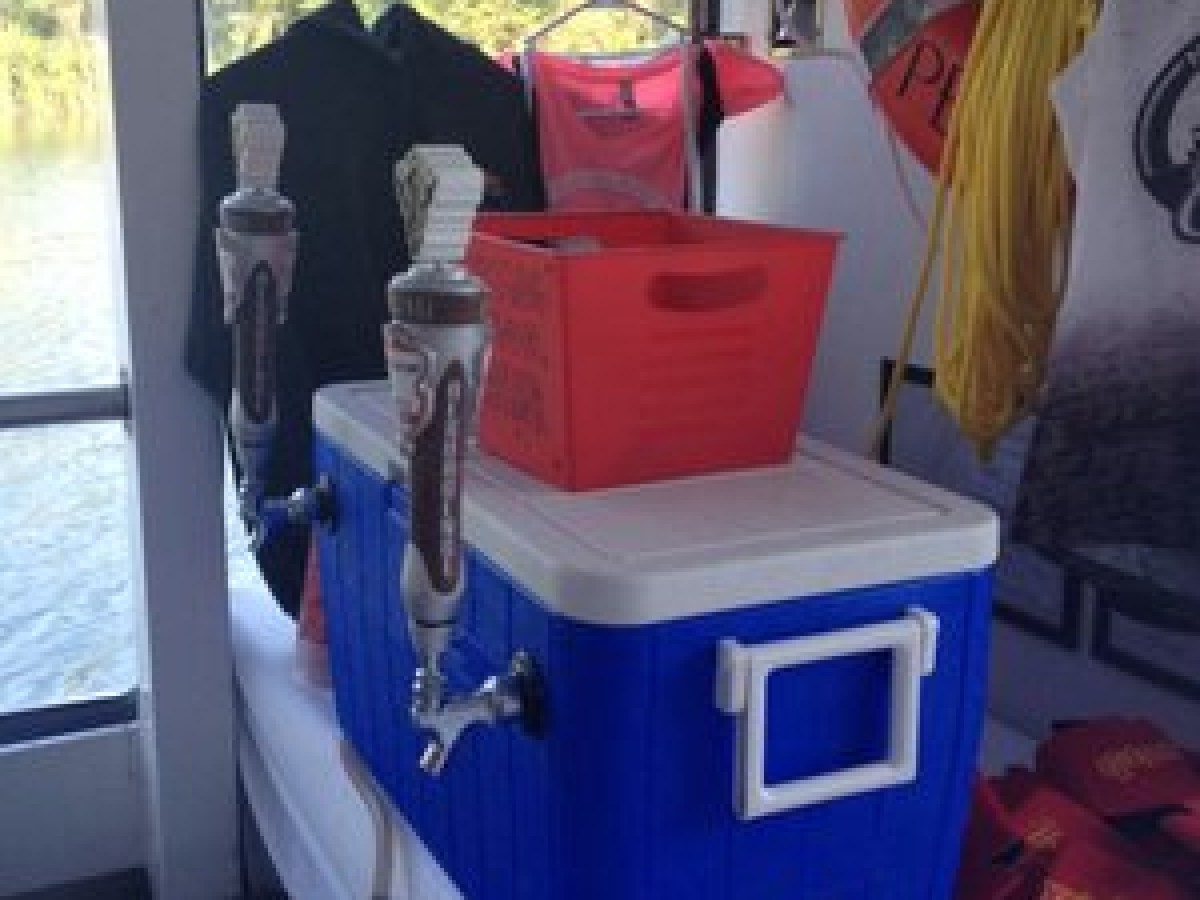 a person sitting at a table in front of a window