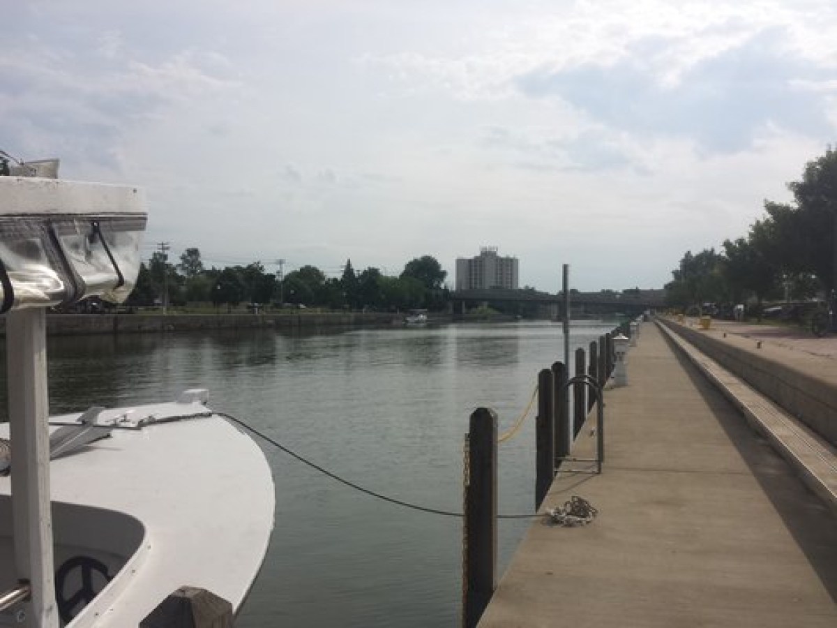 a boat is docked next to a body of water