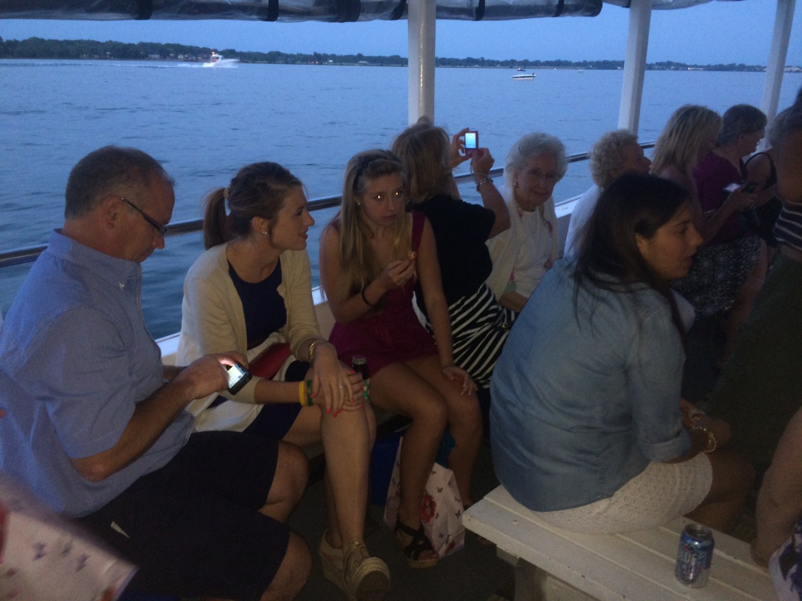 a group of people sitting on a bench