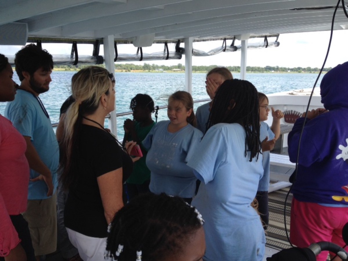 a group of people standing in the water