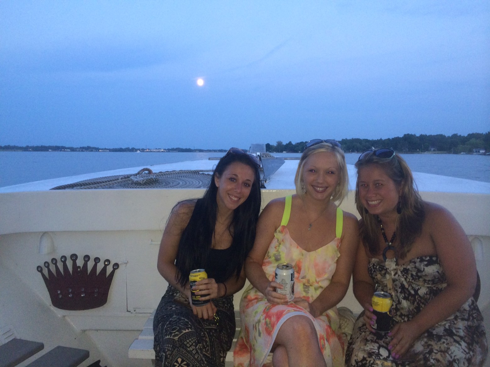 a person standing next to a body of water posing for the camera