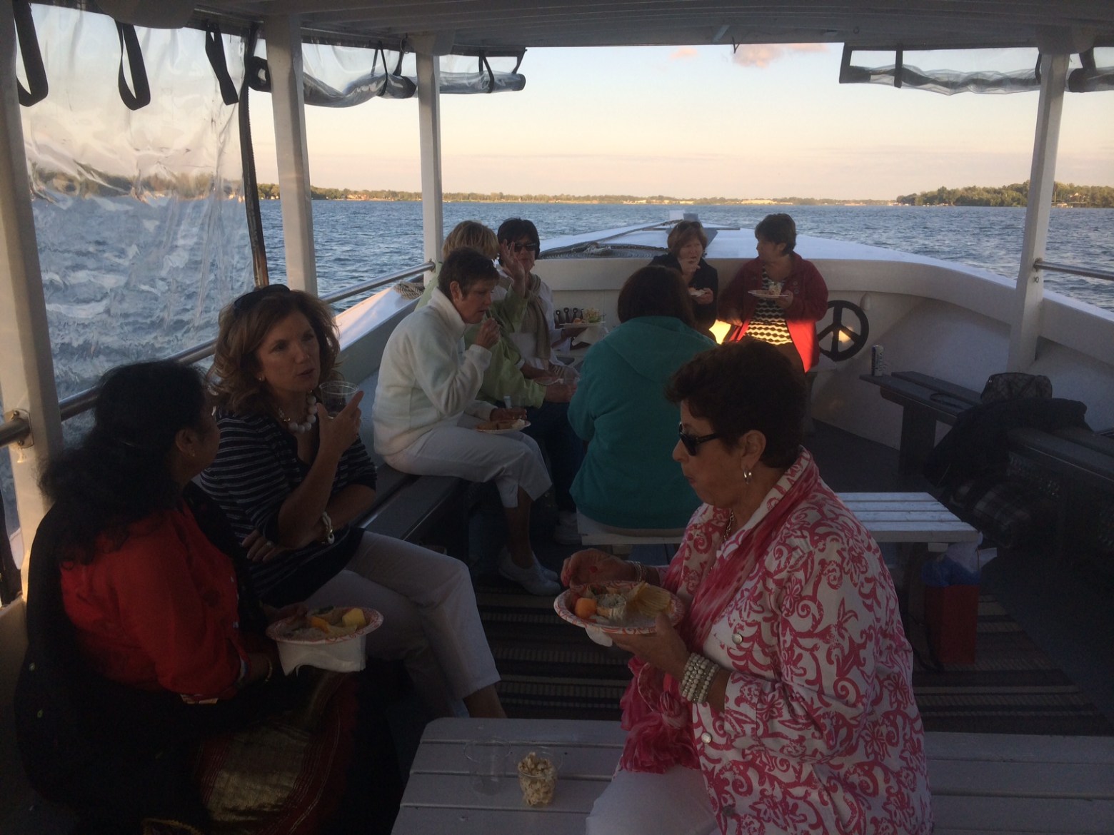 a group of people standing in front of water