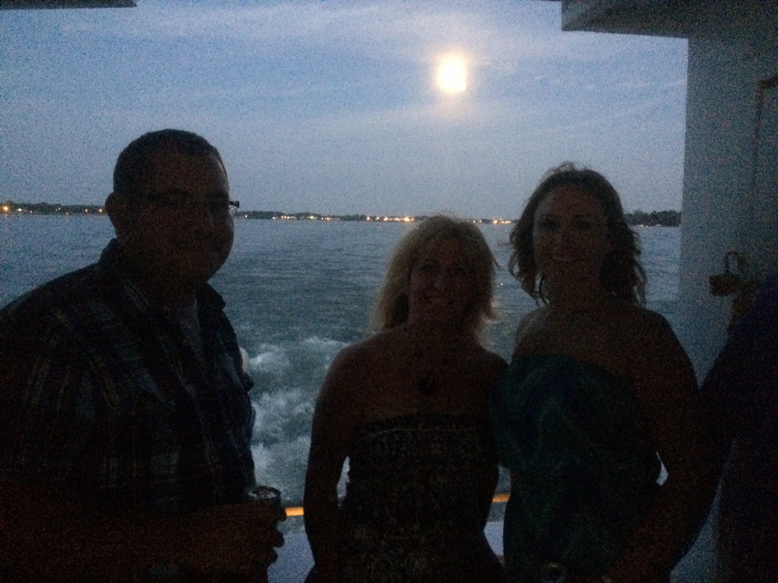 a group of people standing in front of a body of water